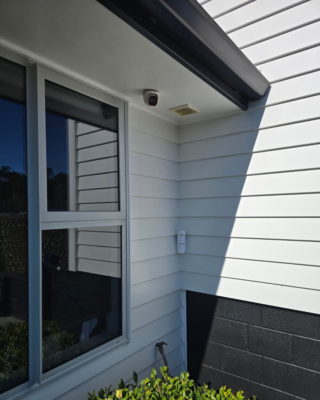 Video intercom doorbell installed beside the front entry of a weatherboard home in Whangaparaoa, Auckland