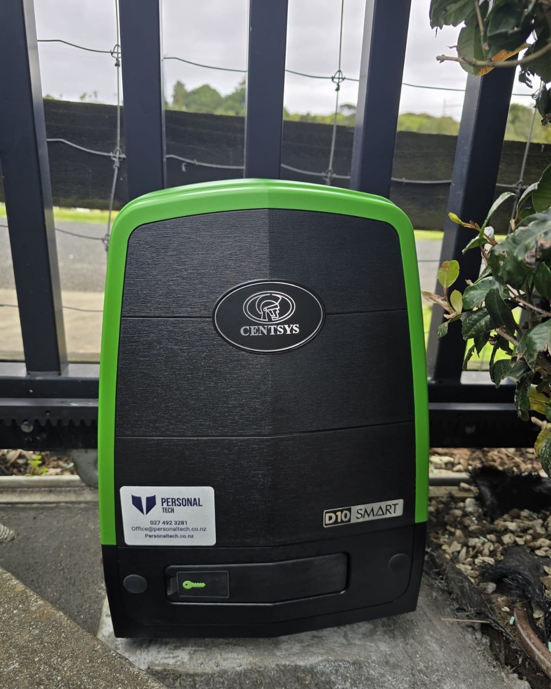 Heavy duty sliding gate motor installed on a concrete pad at a residential gate in Albany, Auckland